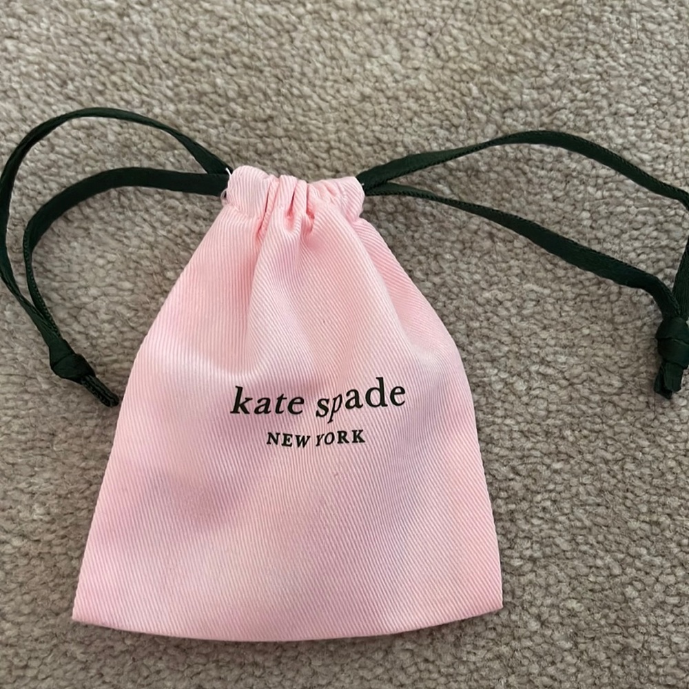 Kate Spade, Grey Earnings